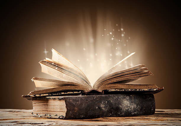 Image of book open with light pouring out of the book