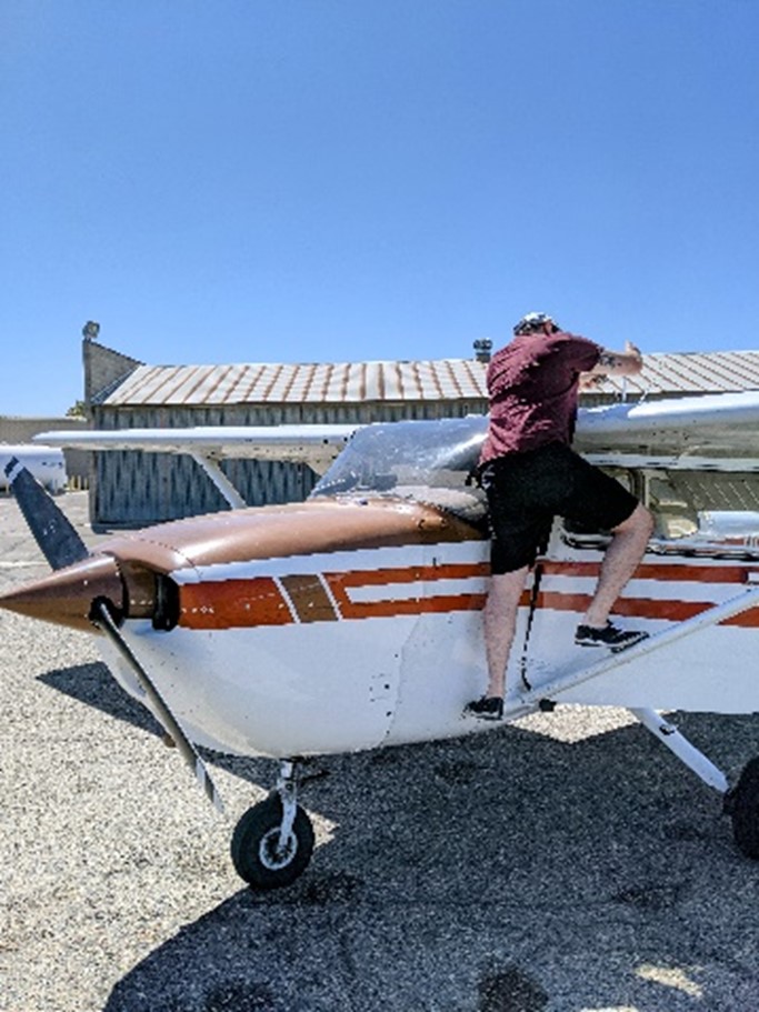 Photo of person working on an airplane
