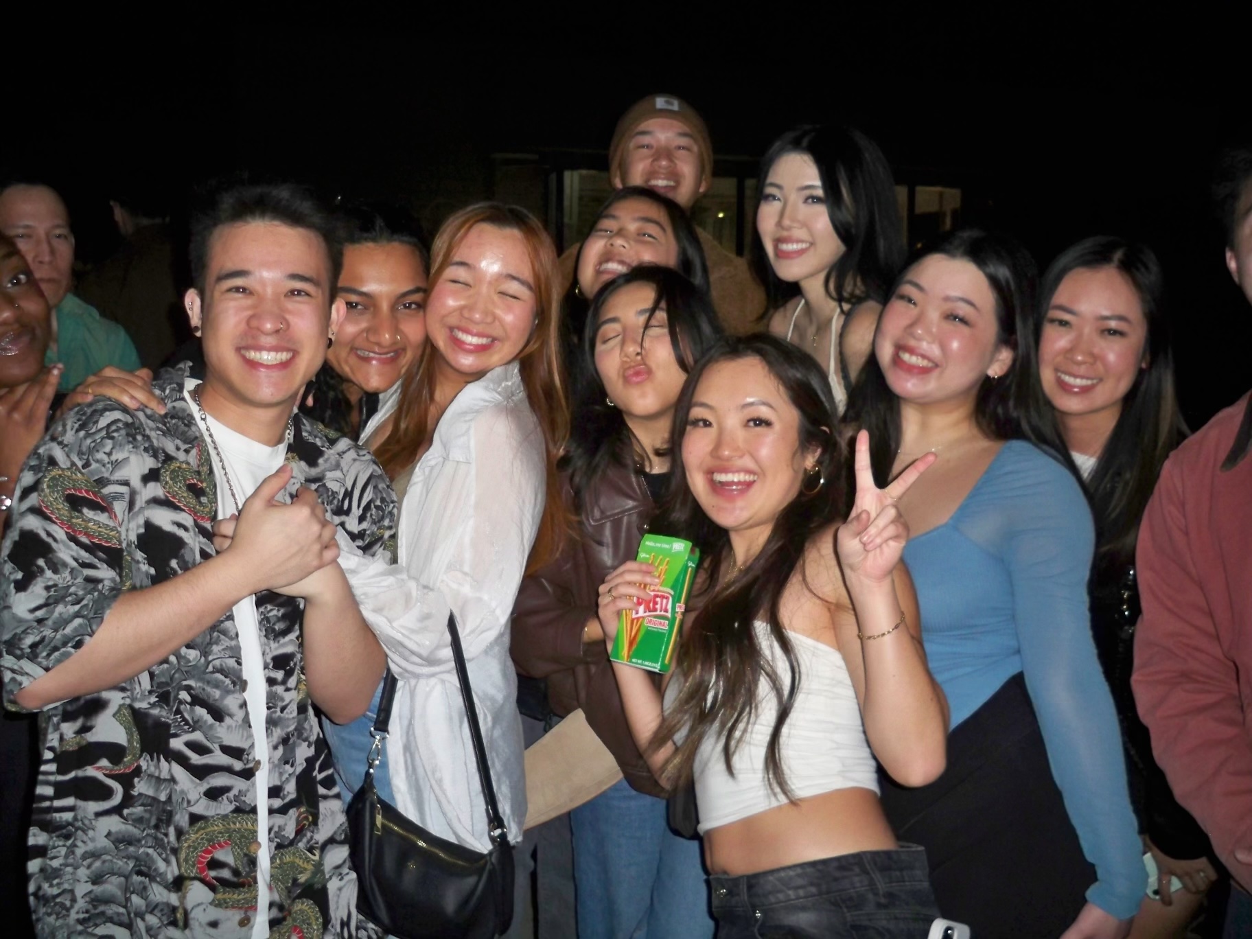 A large group of students standing together and smiling.