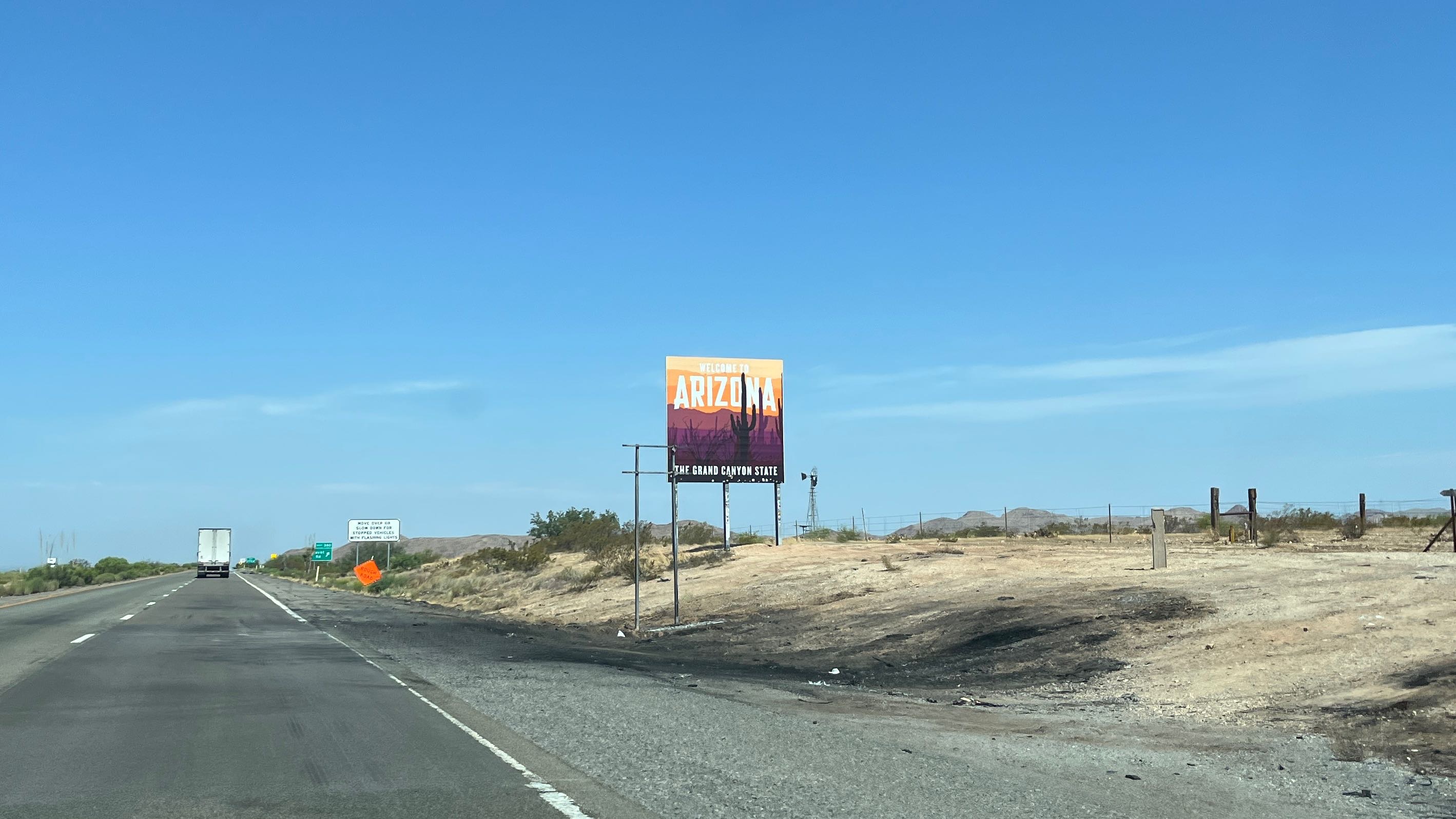 Photo of the Welcome to Arizona sign on the highway